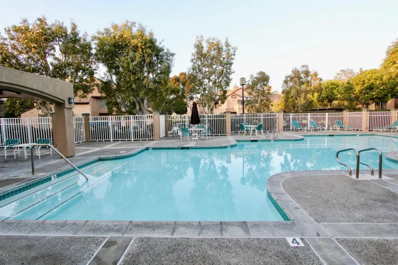 Inside the Apartment, Swimming Pool with dinning table and umbrella in Silvertide