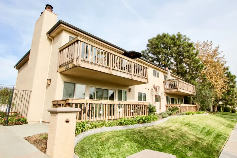 Umbrella is open in one balcony and closed in near balcony of house in Spindrifter condos