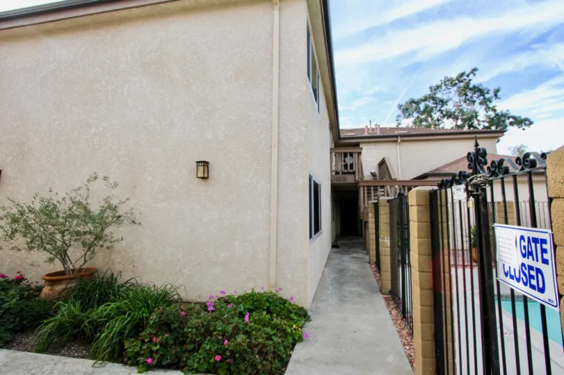 Villa in Spindrifter Condos has flower pot and bushes with flowers