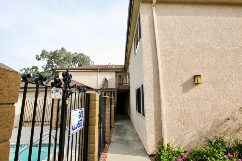 Gate of the Swimming Pool has notice board with some instructions in Spindrifter Condos