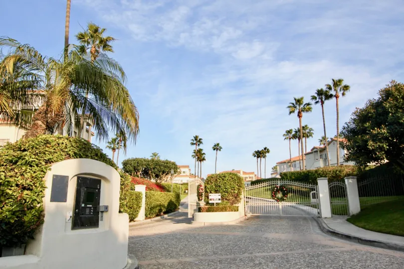 A great day in the Tennis Villas with in front of a gate.