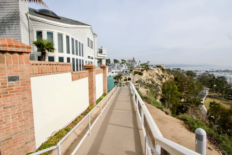 A gorgeous building on a hillside that overlooks a valley at The Admiralty in Dana Point CA