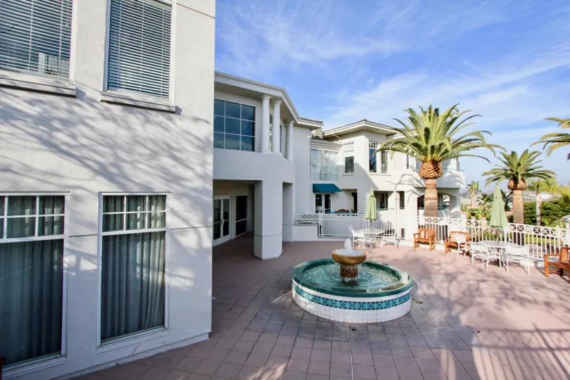 At center of the Apartment in The fountains at Sea Bluffs has fountain and tables