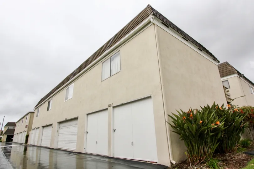 Two level building with garages on first floor in Chateau Blanc community.