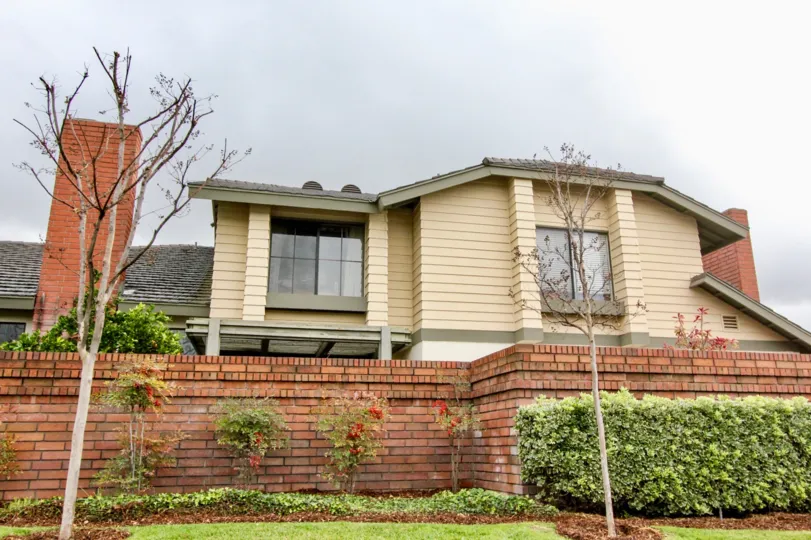 A beautiful house in the Concord Place with beautiful ornamental flowering plants, trees and shrubs.