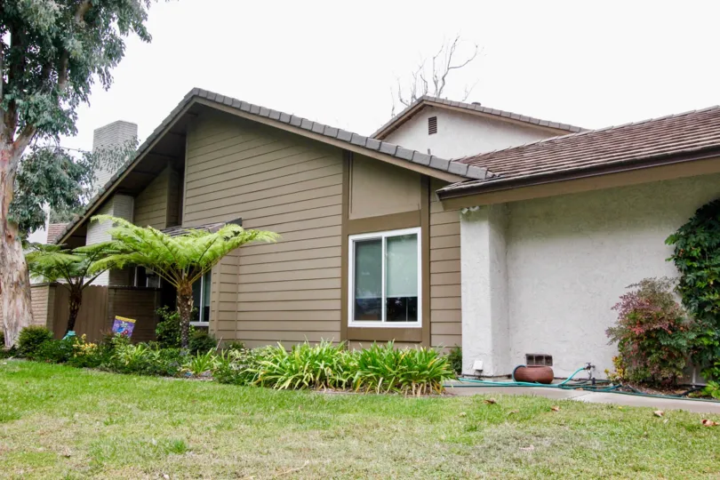 Single level house that is brown in emerald Glen community.