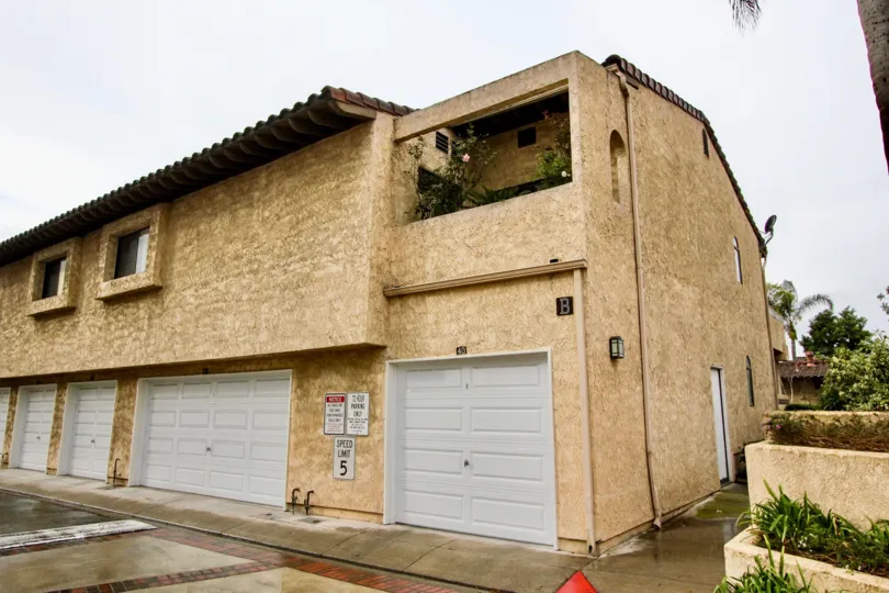The board B is marked in wall of the villa near car shed in Fountain crest and plants in balcony