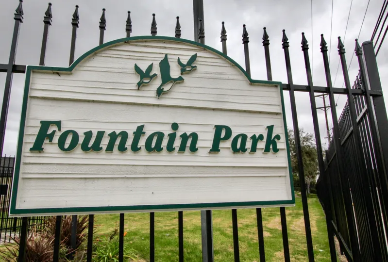 A wooden welcome sign at Fountain Park in Fountain Valley, CA
