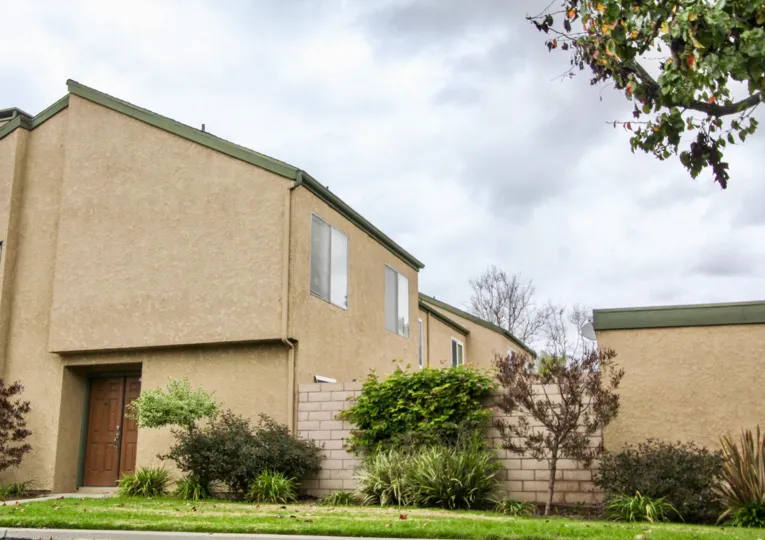 Tan residential housing in Fountain Park community.