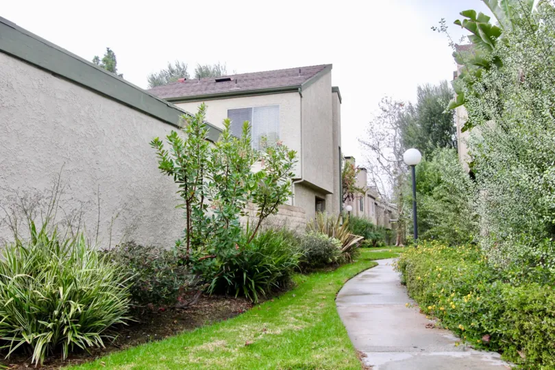 A tall wall lining the edge of residential area in Fountain park community.