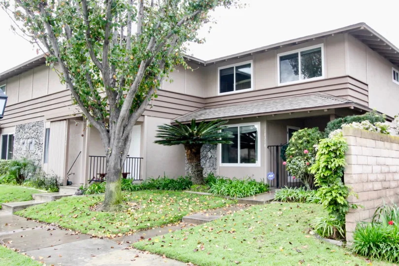 A two story housing structure with six windows at Fountain Plaza in Fountain Valley CA