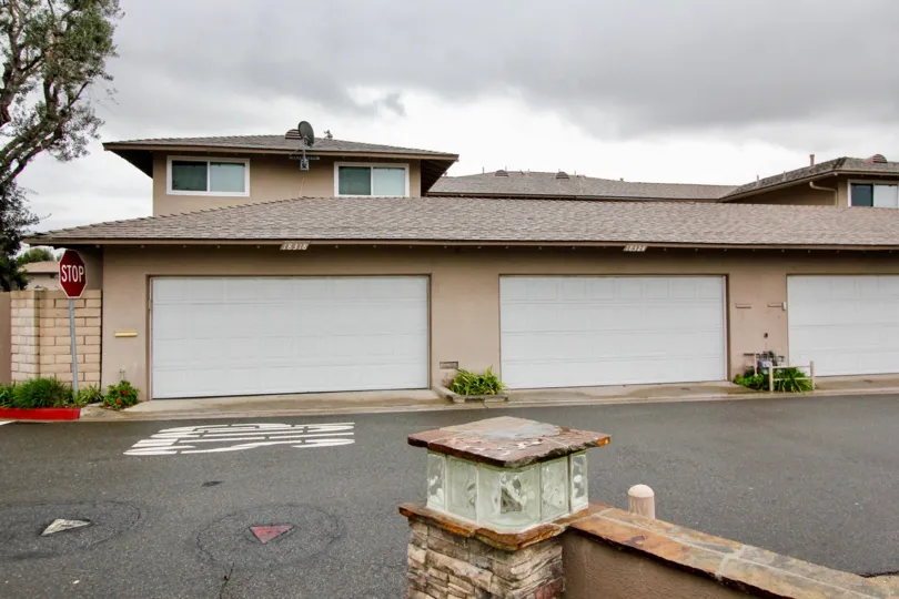 Garage doors along a street in Fountain Plaza at the end of the block.