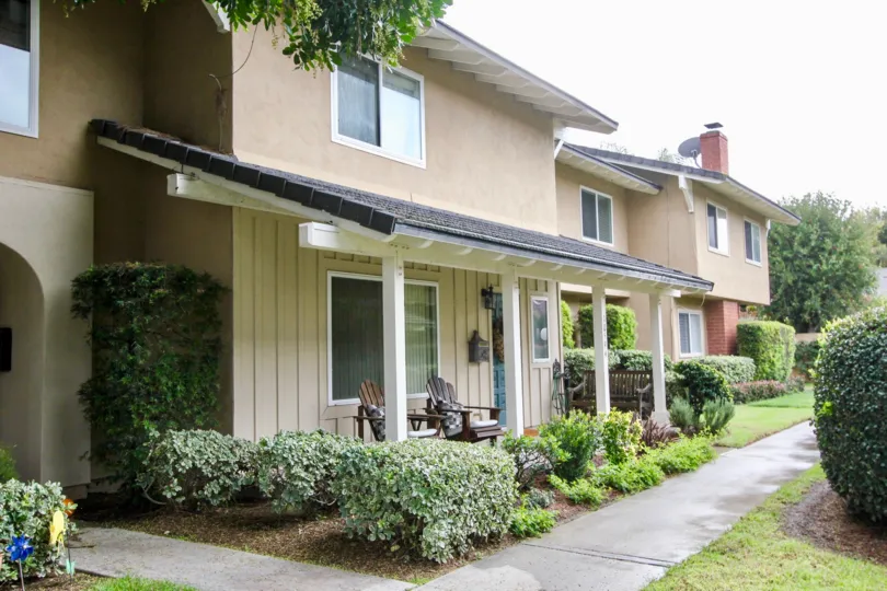 Farmers chairs in front of residential area in Green Valley Townhomes community.