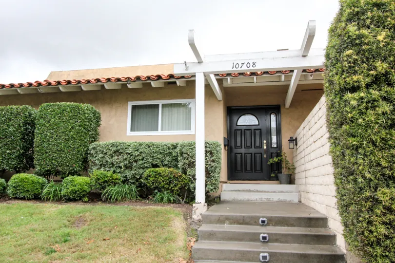 Green Valley Townhomes Fountain California with small pillars, lights in steps, green path in side