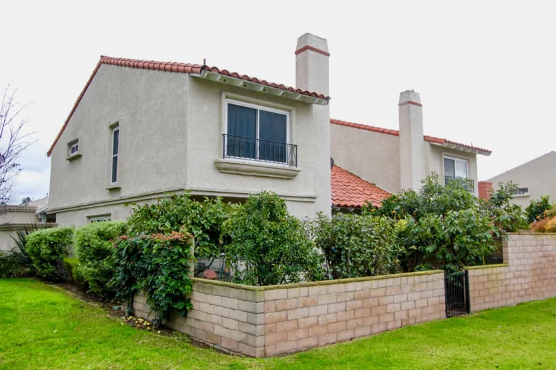 Trees and plants are present inside the compound wall of villa in Green Valley Warner Village