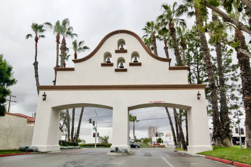 Los Caballeros Fountain Valley California architectural design with bells decorated enterance with clean road