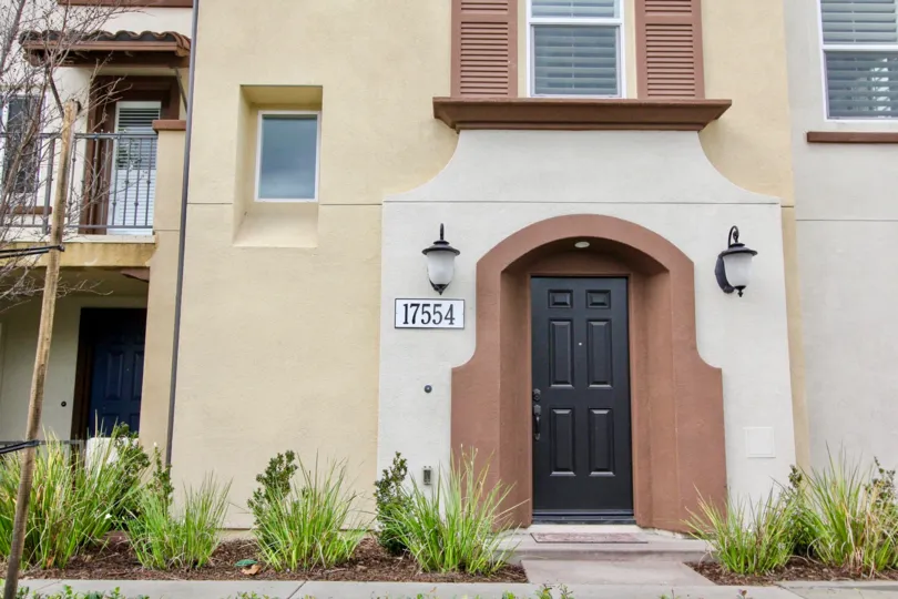 A large and tall black doorway at the entrance of Solana Walk in Fountain Valley CA
