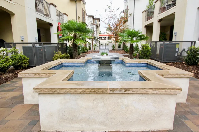Fountain is placed at center of the area in Solana walk where there are few villas with trees and plants