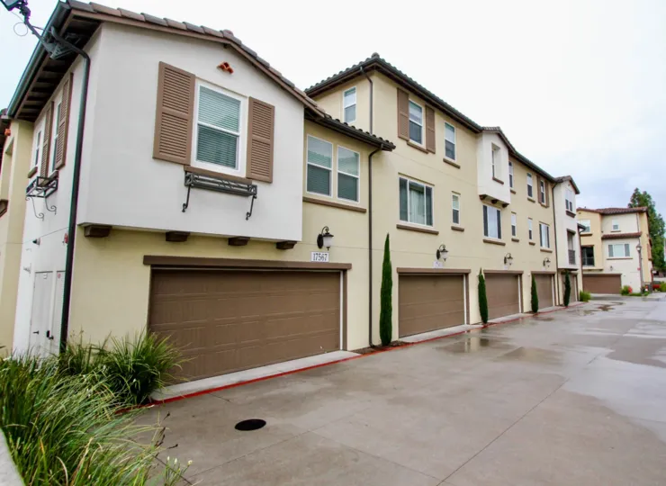 Tan residential houses that have brown garages in Solana Walk community.