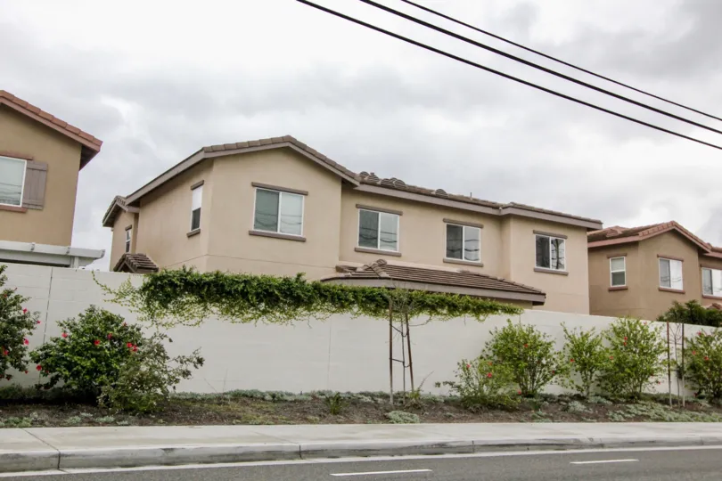Multiple tan residential homes that are the same located in the community Summerstone Villas.