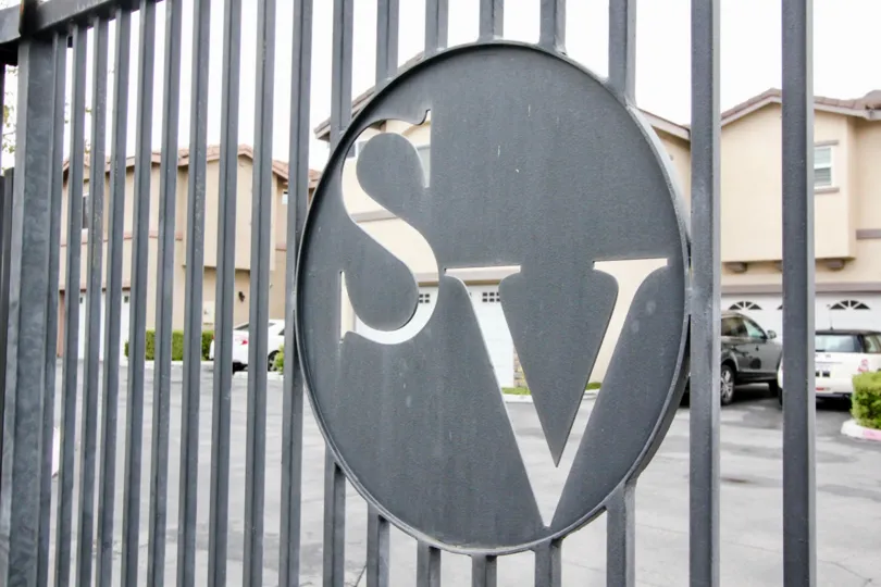 The rainy day in the Summerstone Villas with villas and car parking areas.