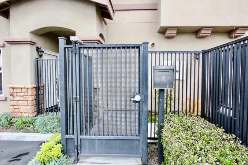 Telephone booth is placed between the gate and cutting bushes of villa in summerstone villas