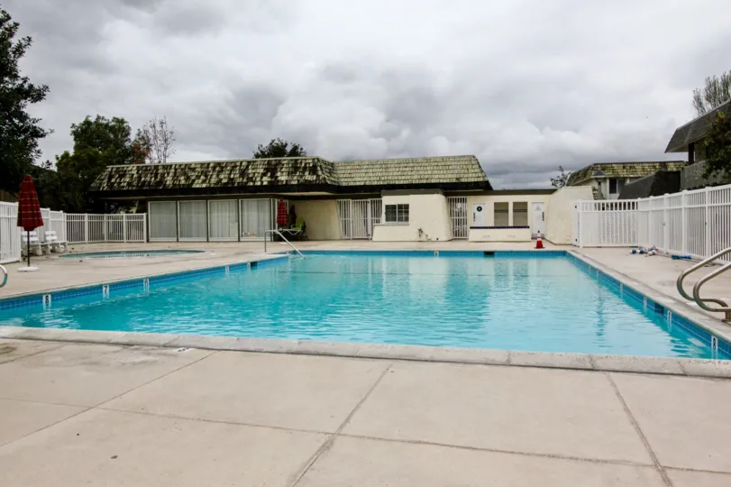 The sunny day in the Tiburon North with swimming pool and picnic chairs