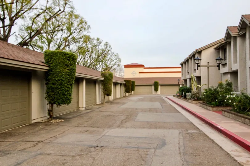 A beautiful day in the Chapman Villas with some buildings and plants.