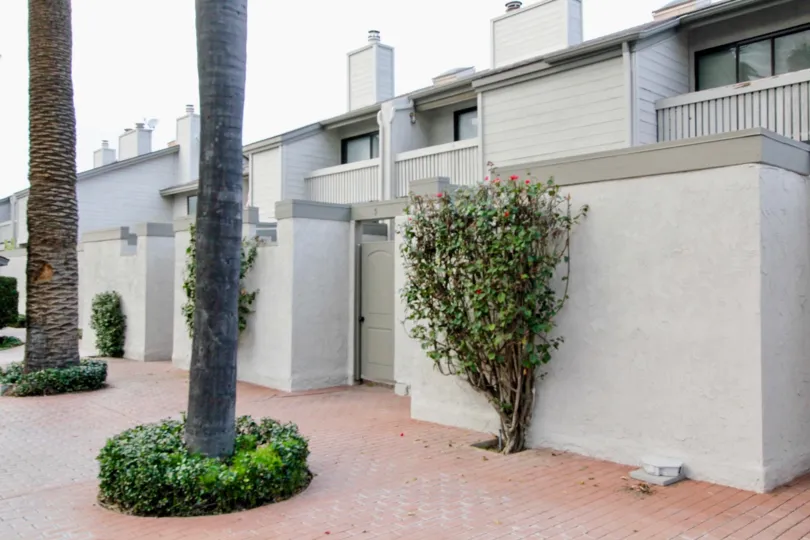A apartment building in Chapman Villas with balconies and trees.
