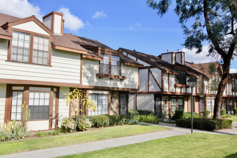 A row of two story apartment buildings in Chelsea Park Estates on a sunny day.