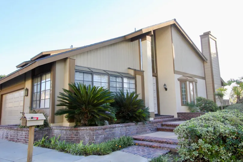 A home in Coyote Hills Greens with stairs and plants on either side.