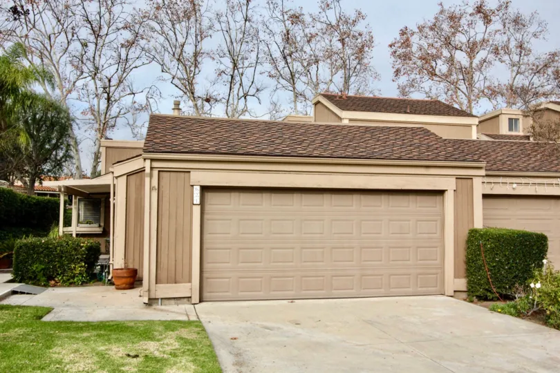 Tan in color two car garage in Fairway Village community.