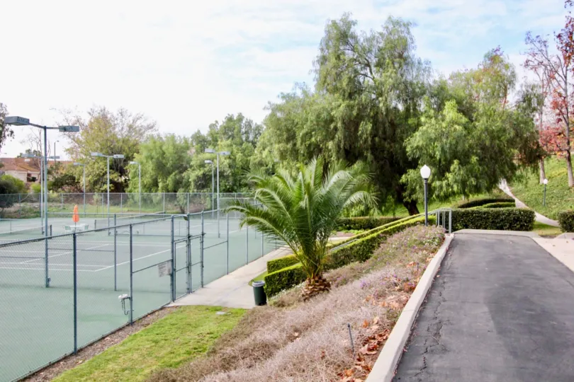 A great day in the Fairway Village with a garden and tennis court.