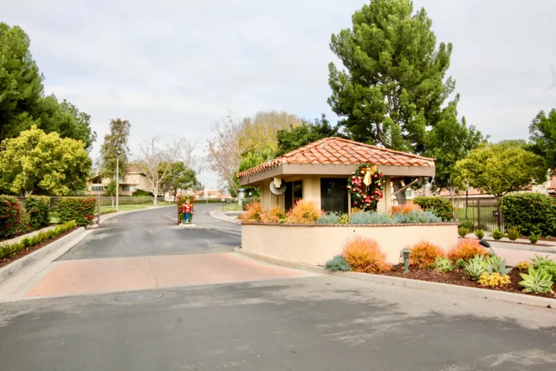 A street in Fairway Village with a small building and a nutcracker.