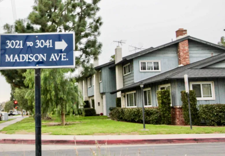 Foothill Village Fullerton California nice colored apartment colony with name board at front gate