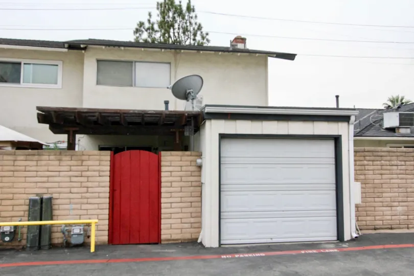 Brick wall with a garage built into it in Foothill village community.