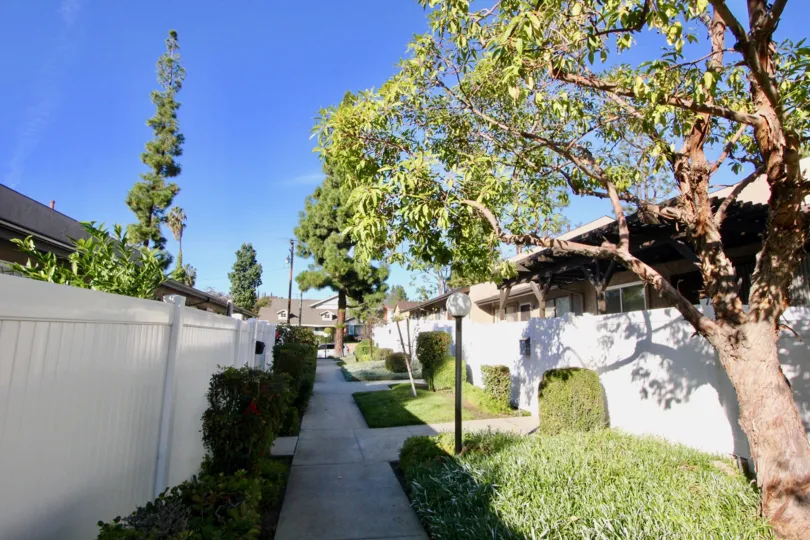 A day in the Gilbert Vista with a path between buildings.