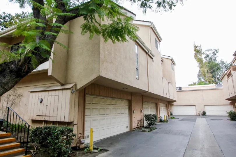 Green Tree Fullerton California emerging top floor over lower one with good compound wall in side