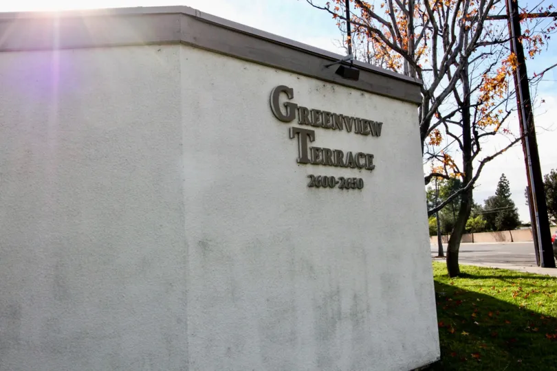 The sunny day in the Greenview Terrace with lawns in the entrance
