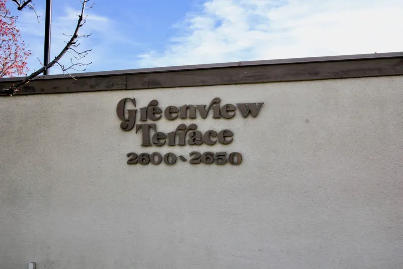 A day in the Greenview Terrace with a sign on the wall.