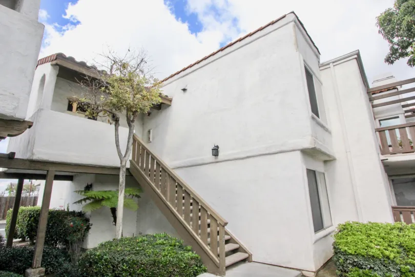 Two level housing with porches on each floor located in Heritage Fullerton community.