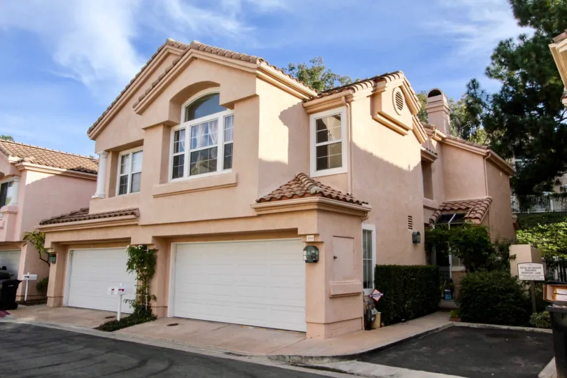 Two car garages and private mail boxes for each unit in Maison de Fleur, Fullerton, CA.