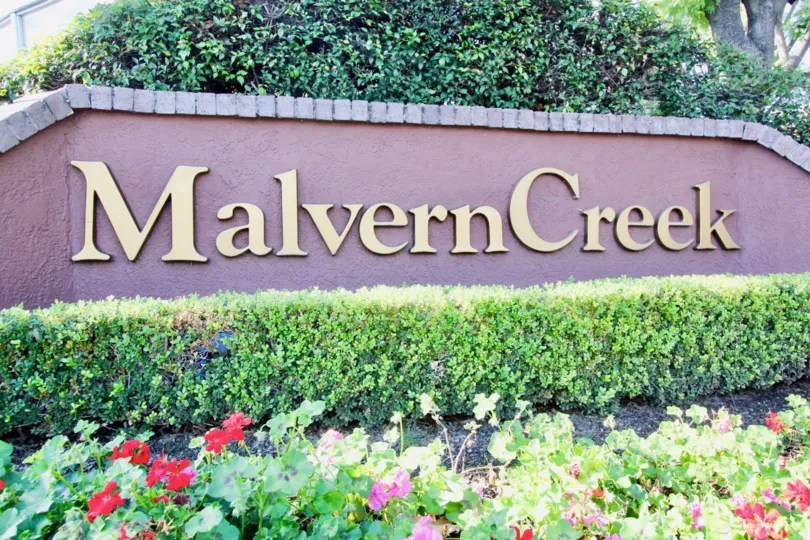 In wall, Indicate the place name called Malvern creek wtih cutting bushes and trees with flowers