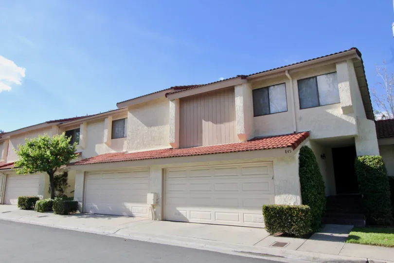 Two story Malvern Creek duplex with garages on a sunny day.