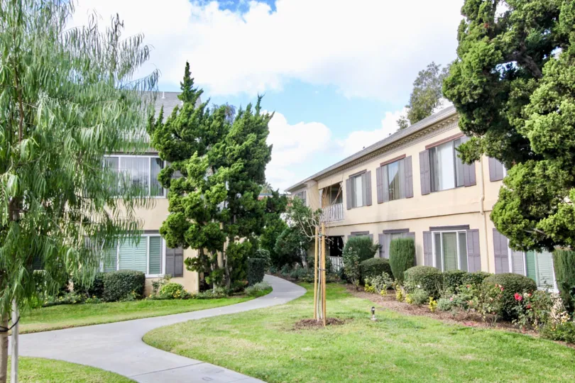 The sunny day in the Meredith Manor with villas and gardens.