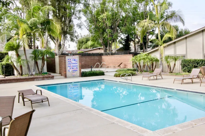 In a sunny day a swimming pool with full of water without girls in Orchard Lane, Fullerton city, CA