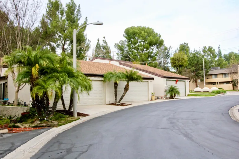 Street light lamps is placed near the plants and trees of villa at Park Vista