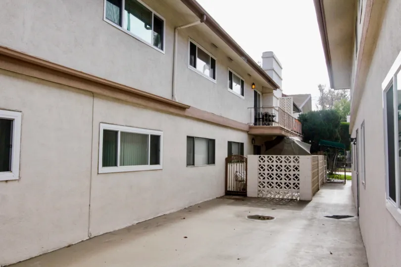 a space between white two story buildings at shadow lane community in fullerton, california.