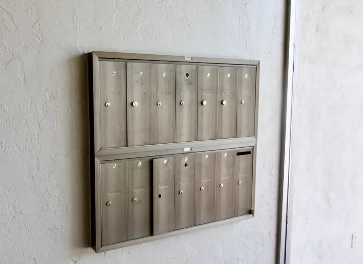Multiple mailboxes in rectangle shape together in Shadow Lane community.