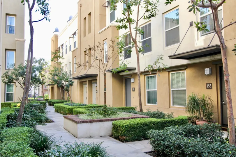 The sunny day in the Soco Walk with villas and gardens.